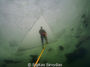 Under ice by Sigitas Sirvydas 